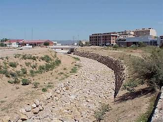 Torrent del Lluc - looking upstream. The terrace to the left of the channel covers a separate drain serving an industrial estate. Channelisation completed in 2001